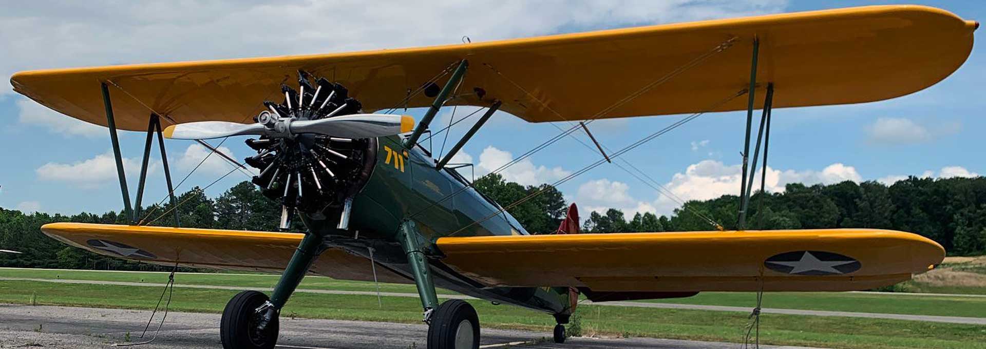 Bi-wing single prop plane at KCMD